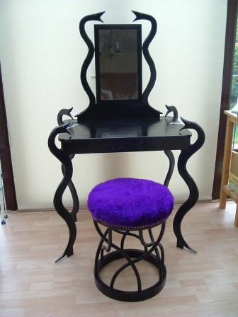 My daughter asked me to make her a dressing table set and provided an outline design to illustrate what she wanted. I developed this into something I could make and this is the result. Making the 'den of snakes' stool was the most challenging part.