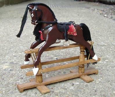 I then tried my had at a series of dolls house sized (1/12th scale) horses. Yogi here is on a swinger stand and has cast silver stirrups and swinger brackets.